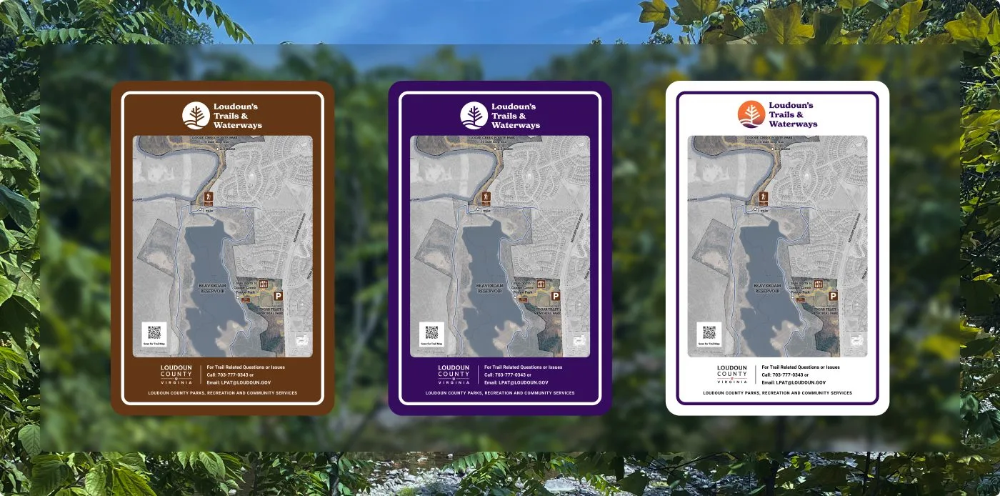 Three Loudoun’s Trails & Waterways Signs with the logo and a map in brown, purple, and white versions with green leaves in the background